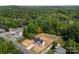 Aerial view of property, showing the house, yard, and wooded surroundings at 5037 Faith Rd, Salisbury, NC 28146