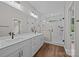 Contemporary bathroom features a double vanity, an oversized mirror, and a glass enclosed shower at 5037 Faith Rd, Salisbury, NC 28146