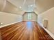 Bright bedroom featuring hardwood floors, skylight and neutral paint at 5037 Faith Rd, Salisbury, NC 28146