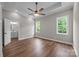 Spacious bedroom featuring hardwood floors, a ceiling fan, and an ensuite bathroom at 5037 Faith Rd, Salisbury, NC 28146