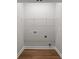 Empty closet space with hardwood floors, wire shelf, and washer/dryer hookups at 5037 Faith Rd, Salisbury, NC 28146