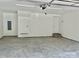 View of the spacious, two-car garage with concrete floors and white walls at 5037 Faith Rd, Salisbury, NC 28146