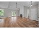 Spacious living room with hardwood floors, a ceiling fan, fireplace and french doors at 5037 Faith Rd, Salisbury, NC 28146