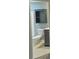Bathroom offering toilet, shower and built in shelving at 1826 Birch Heights Ct, Charlotte, NC 28213