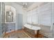 Bright bathroom with a freestanding tub, shower, and light blue vanity at 2408 Westfield Rd, Charlotte, NC 28207