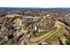 Aerial view of neighborhood, highlighting golf course, tennis courts, and pool at 2425 Birdie Ne Ln, Conover, NC 28613
