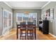 Charming dining room with hardwood floors, large windows, and elegant lighting at 2425 Birdie Ne Ln, Conover, NC 28613