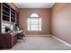 Home office featuring built-in bookshelves, a desk, and a window with natural light at 2425 Birdie Ne Ln, Conover, NC 28613