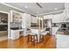 Well-lit kitchen features an island with bar seating, granite counters, and stainless steel appliances at 2425 Birdie Ne Ln, Conover, NC 28613