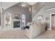 Comfortable living room with fireplace, arched windows, and carpet flooring at 2425 Birdie Ne Ln, Conover, NC 28613