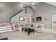 Comfortable living room with carpet flooring, stairs and a view of the kitchen at 2425 Birdie Ne Ln, Conover, NC 28613