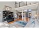 Bright living room with hardwood floors, a tall ceiling, and a view of the dining room and front entrance at 2425 Birdie Ne Ln, Conover, NC 28613