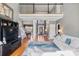 Bright living room with hardwood floors, a tall ceiling, and a view of the dining room and front entrance at 2425 Birdie Ne Ln, Conover, NC 28613