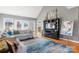 Comfortable living room with hardwood floors, natural lighting, and media center at 2425 Birdie Ne Ln, Conover, NC 28613