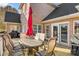 View of the outdoor deck and grill, which is situated next to doors entering the home at 2425 Birdie Ne Ln, Conover, NC 28613