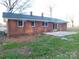 Brick home featuring a backyard patio, perfect for outdoor relaxation at 8600 E Highway 74 E Hwy, Marshville, NC 28103