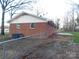 Brick home, partially fenced, with a small back patio at 8600 E Highway 74 E Hwy, Marshville, NC 28103