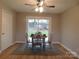 Cozy dining room with a modern ceiling fan, slider to yard, and table for four at 8600 E Highway 74 E Hwy, Marshville, NC 28103