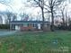 Charming single-story brick home with an attached carport and black shutters at 8600 E Highway 74 E Hwy, Marshville, NC 28103