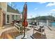 Spacious deck overlooking lake with seating and umbrella at 131 Point Of View Dr, Mooresville, NC 28117