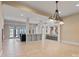 Bright dining room with tile floors and an open view to the kitchen and living areas at 148 Quaker Rd, Mooresville, NC 28117