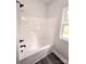 Freshly remodeled bathroom features a new white bathtub and modern black fixtures at 1589 Maysville Rd, Shelby, NC 28150