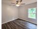 Cozy bedroom features stylish dark wood floors and a ceiling fan at 1589 Maysville Rd, Shelby, NC 28150