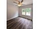 Bedroom with luxury vinyl plank flooring, a ceiling fan and natural light from a window at 1589 Maysville Rd, Shelby, NC 28150