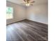 Comfortable bedroom boasts modern ceiling fan and dark wood flooring at 1589 Maysville Rd, Shelby, NC 28150