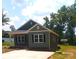 Stylish one-story home with green siding, black shutters, and a concrete driveway and sidewalk at 1589 Maysville Rd, Shelby, NC 28150