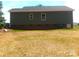 Home exterior with modern siding, a brick foundation and a well-manicured lawn at 1589 Maysville Rd, Shelby, NC 28150