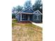 Charming single-story home featuring a covered front porch, and professionally landscaped yard at 1589 Maysville Rd, Shelby, NC 28150