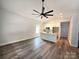 Open-concept kitchen with white cabinets, a marble countertop island, and modern pendant lighting at 1589 Maysville Rd, Shelby, NC 28150