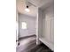 Mud room area features luxury vinyl plank floors, an exterior door, and a built-in bench at 1589 Maysville Rd, Shelby, NC 28150