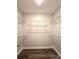 Walk-in closet features custom wire shelving and luxury vinyl plank flooring at 1589 Maysville Rd, Shelby, NC 28150