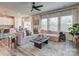 Spacious living room with light beige sectional sofa and large windows at 2123 Belterra Dr, Charlotte, NC 28216