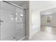 A modern bathroom features a glass-enclosed shower and a large tub at 3110 Westerwood Dr, Charlotte, NC 28214