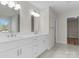 A modern bathroom features a dual sink vanity with quartz countertop and tile floor at 3110 Westerwood Dr, Charlotte, NC 28214