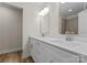 Well-lit bathroom features a double vanity with modern fixtures and lots of storage space at 3110 Westerwood Dr, Charlotte, NC 28214