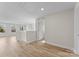 Large bonus room with wood-look floors and plenty of natural light from large window at 3110 Westerwood Dr, Charlotte, NC 28214
