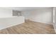 Open bonus room with wood-look flooring offers versatile living space and natural light at 3110 Westerwood Dr, Charlotte, NC 28214