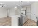 Open kitchen with large island, stainless steel appliances, and pendant lighting at 3110 Westerwood Dr, Charlotte, NC 28214