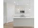 A stylish kitchen with stainless steel appliances, a central island with sink, and sleek countertops with a clean design at 3110 Westerwood Dr, Charlotte, NC 28214