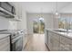 Open kitchen with stainless steel appliances, ample cabinets and light countertops at 3110 Westerwood Dr, Charlotte, NC 28214