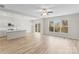 Living room area open to the kitchen with great natural light at 3110 Westerwood Dr, Charlotte, NC 28214