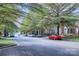 Street view of homes with mature trees in a sidewalk neighborhood at 155 Singleton Rd, Mooresville, NC 28117