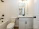 Bathroom featuring a sink, vanity, toilet, and a shower tub combination at 161 Halite Ln, Waxhaw, NC 28173