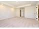 Bright bedroom with tray ceiling, recessed lighting and neutral carpet at 161 Halite Ln, Waxhaw, NC 28173