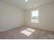 Bright bedroom with a large window providing natural light at 161 Halite Ln, Waxhaw, NC 28173