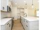 Well-lit kitchen with a large island, stainless steel appliances, and a stylish backsplash at 161 Halite Ln, Waxhaw, NC 28173